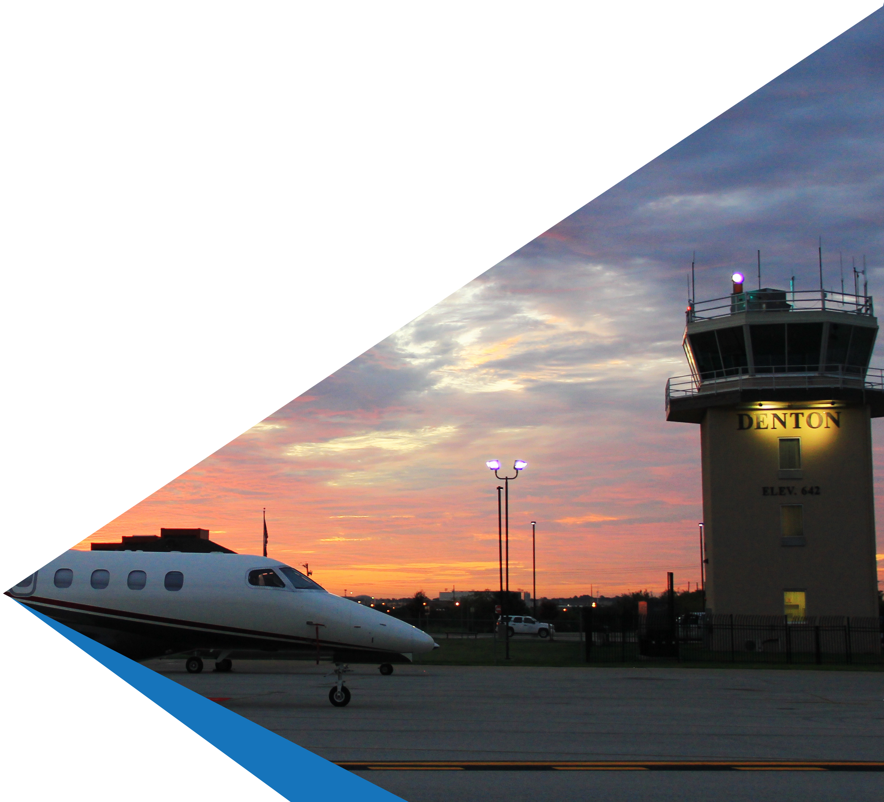 Denton Control tower and plane at dusk with blue strip